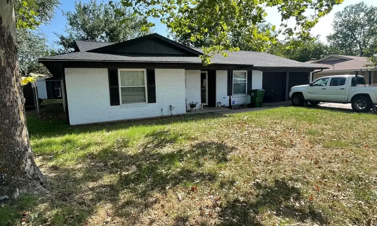 Professional roofing crew working on a residential roof in Essex
